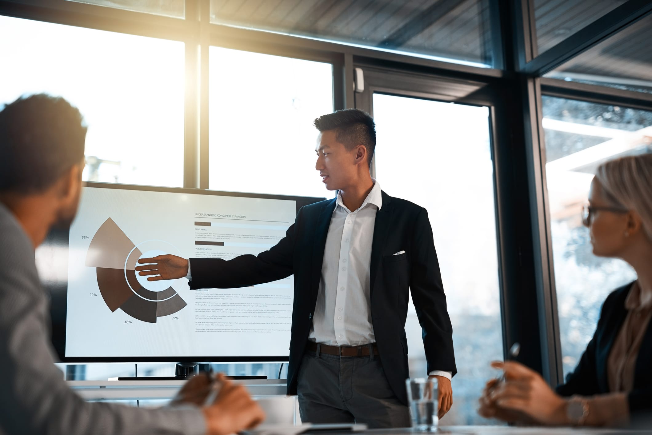 Shot of a young businessman giving a presentation to his colleagues in an office