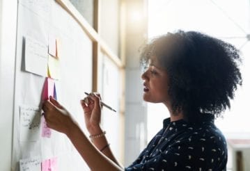 Shot of a young female designer working in her office