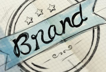 The word "brand" decoratively drawn in a notebook