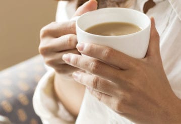 Woman holding a coffee mug
