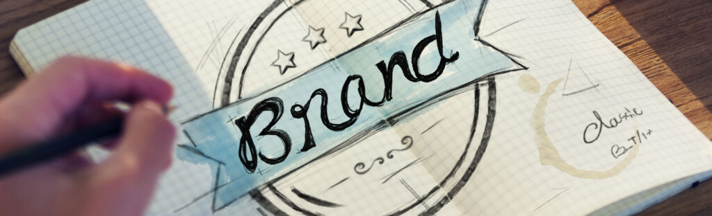 The word "brand" decoratively drawn in a notebook