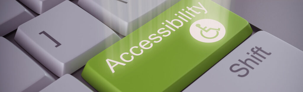Close up of a keyboard, but instead of an enter key, there is a green accessibility key