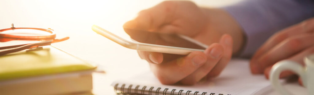 Close up of a hand holding a mobile phone