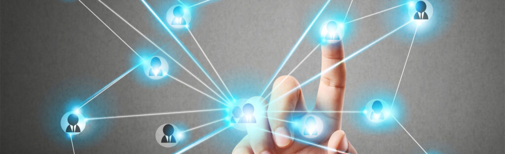 A hand touching a floating graphic of interconnected icons